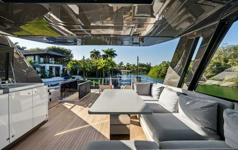 Ferretti 780 Motor Yacht Sunsation shaded L-shaped grey seating on flybridge 
