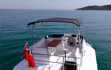 Flybridge seating and helm layout on the Beneteau Swift Trawler 37 Fly