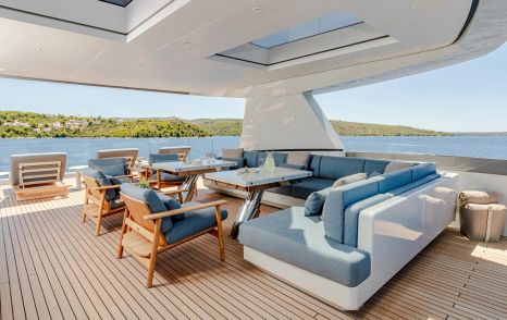 Superyacht Kinda sundeck with shaded blue seating