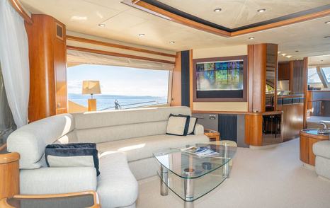 Motor Yacht Harrys Game interior seating area and mounted TV