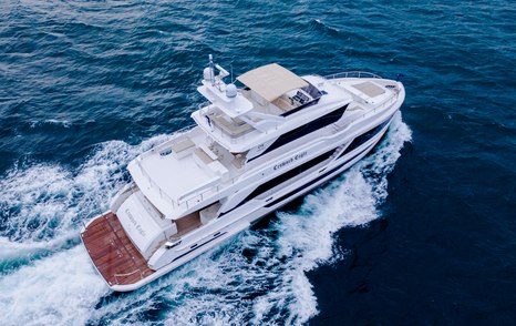 Elevated view of Horizon FD92 tri-deck, aft deck in view with yacht underway, surrounded by sea