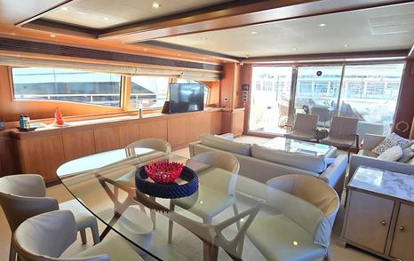 Bleu Blanc main saloon dining area with table, seating, and large windows