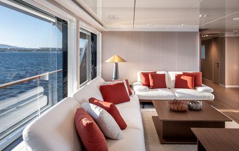 Close up of Superyacht Tuccini main saloon seating area with white sofas 