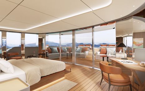 Master suite onboard the Custom Line Navetta 50. Central berth facing forward with surrounding large glazing and seating outside.