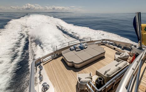 Superyacht Cabo's aft with sunpads under way