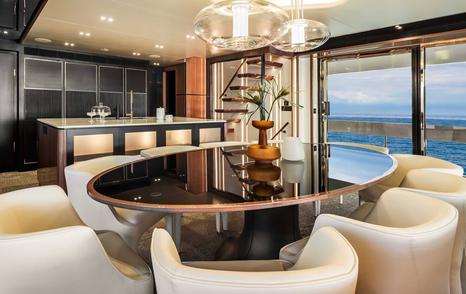 Horizon FD100 Skyline Superyacht dining area with glass lightings and black dining table 