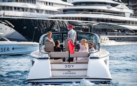 Visitors to the Monaco Yacht Show on a tender in Port Hercule