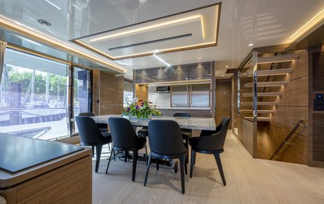 Dining area onboard superyacht ISSIMO, with staircase in background