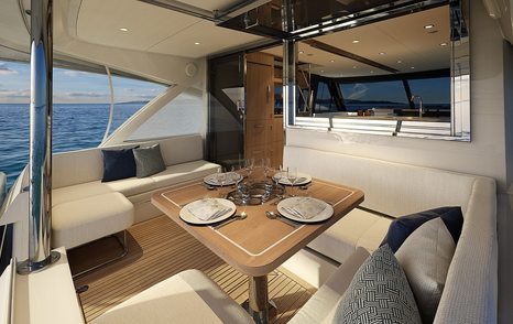 Riviera 58 sports motor yacht aft cockpit dining configuration