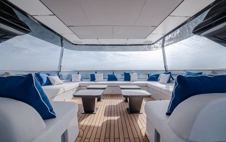 Majesty 112 Terrace Motor Yacht upper deck with shaded U-shaped white seating