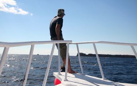 man on yacht bow