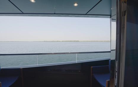 Fold-down owner's balcony aboard the Gulf Craft Majesty 145 overlooking the water