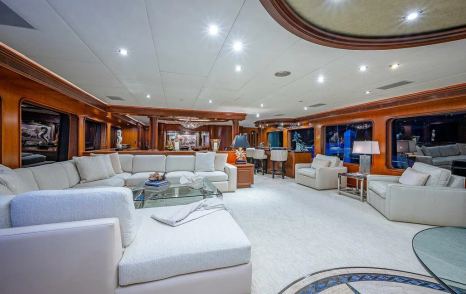 Superyacht La Sirena's main saloon with U-shaped sofa