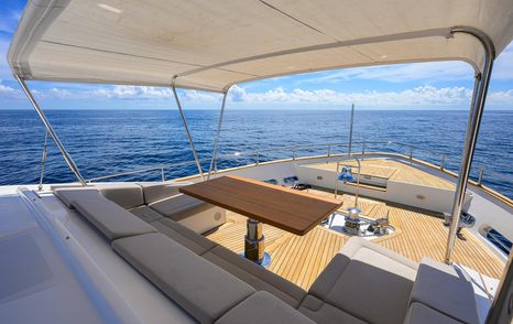 Motor yacht Argento's upper deck seating and table