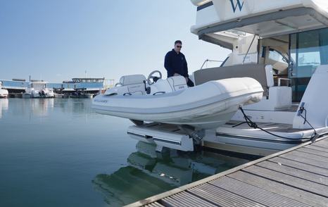 Williams jet tender on the Fairline Squadron 42's narrow hydraulic tender lift, showing the unusual stern platform arrangement.