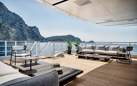 The main deck aft onboard NEVER SAY NEVER AGAIN features more comfortable seating and steps to the lower deck