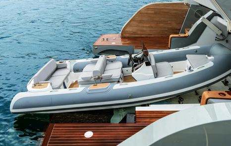 Custom Line Navetta 38 tender garage with 5.5m tender launched from aft platform system