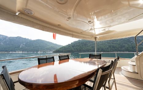 Motor yacht Senior S aft deck dining area 