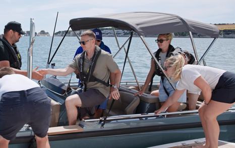 Guests transferring from the Evene Origin 71 onto the Sunseeker Manhattan 65