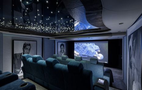 Superyacht Ahpo indoor cinema with blue plush seating