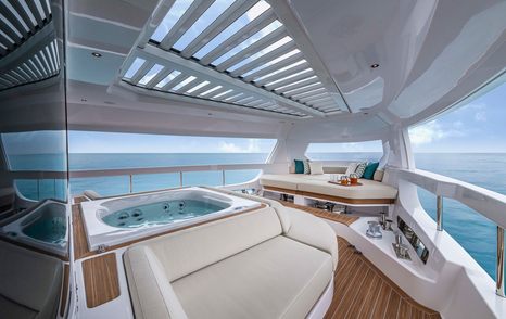 The Ferretti INFYNITO 90 all season terrace complete with a jacuzzi and seating