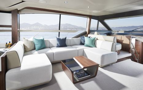 Light and airy interior on Princess F62, with large sofa and table