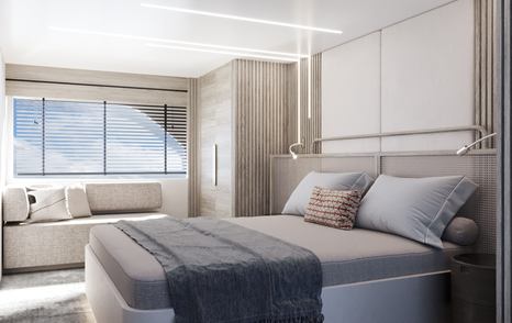 Master cabin onboard Numarine 22XP, large bed centre of the cabin with window on far side.