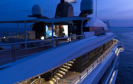Superyacht DreAMBoat outdoor cinema at night