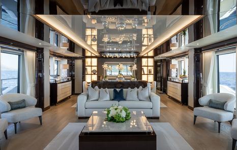 Superyacht Berco Voyager main saloon white furniture and dining area 