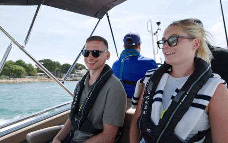 Guests seated aft aboard the Evene Origin 71 during transfer to the yacht