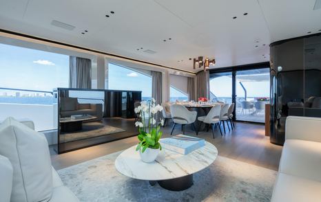 Motor Yacht Jacqpot main saloon with TV and L-shaped sofa