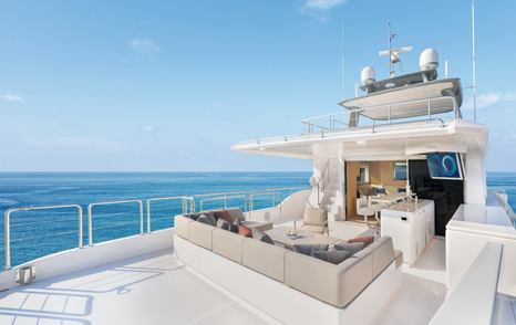 Seventh Horizon FD110 motor yacht aft deck seating and shaded bar area 