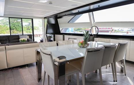 Pershing motor yacht Queen B Sport main saloon dining area 