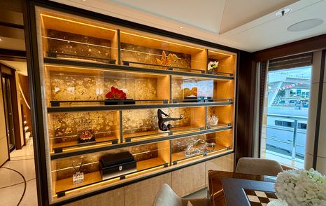 Decorative illuminated display shelving on the owner’s deck lounge of the Amels 242 Casino Royale.