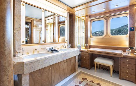Ensuite bathroom on motor yacht Vibrance with twin sinks and vanity