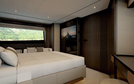 Owner's cabin on motor yacht Ferretti 800 with television and wardrobe space 
