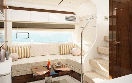 Fairline Targa 47 main saloon with white sofa and wooden table