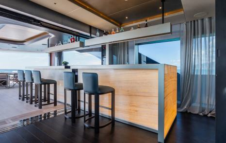 Superyacht Silver Star I interior bar area with black stools