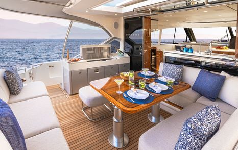 Riviera 5600 Sport Platinum Edition cockpit with aft galley and dining area
