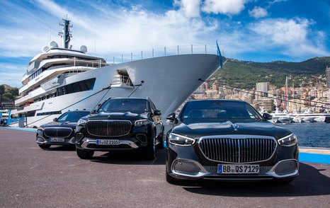 Motor yacht RENAISSANCE berthed in Port Hercule with trio of black cars in the foreground