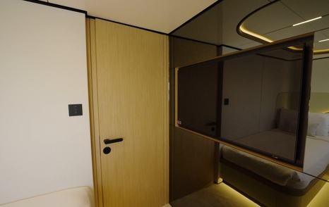Television and storage in a twin guest cabin on the Gulf Craft Majesty 100 Terrace