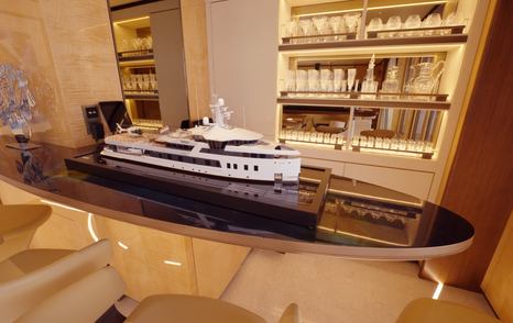 Floating bar feature inside the bridge deck lounge on the Amels 242 Casino Royale with illuminated glass shelving.