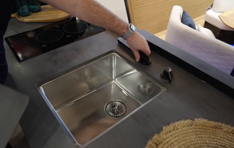 The tap sits flush to the counter when not in use 