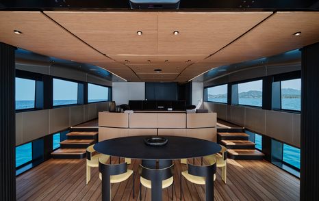 wallywhy150 motor yacht saloon with circular dining table