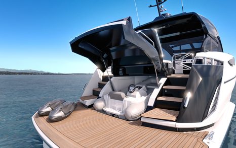 Sunseeker Predator 55 for sale at Fort Lauderdale International Boat Show, aft deck shot showing transom door lifted and tender stowed