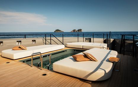 Rossinavi Superyacht Heed aft with white sunpads surrounding pool