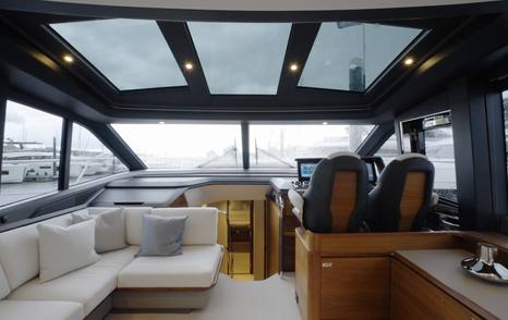 Princess S65 Mk2 saloon and lower helm beneath the three-panel glass sunroof