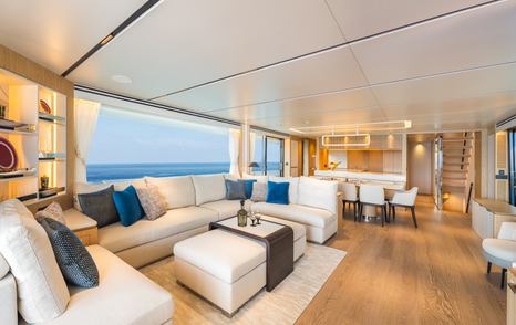 Seventh Horizon FD110 motor yacht main saloon with U-shaped white sofa 