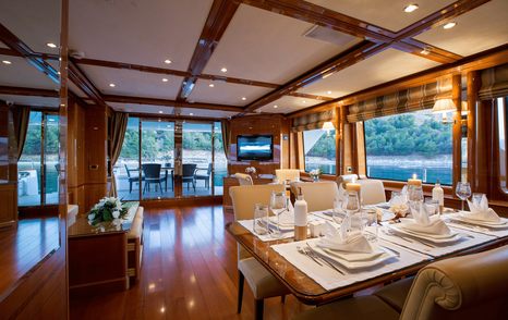 Dining areas in main saloon on superyacht Rebecca V