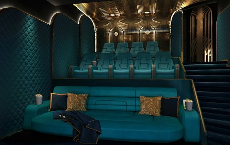 Superyacht Kismet cinema with teal seating and gold lighting